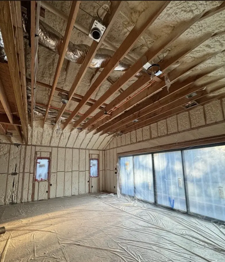 Interior walls and ceiling insulated with spray foam during new construction in Timberlake